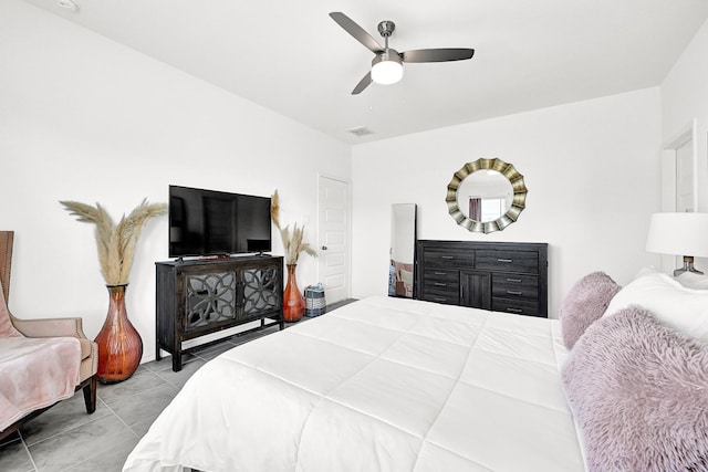 tiled bedroom featuring visible vents and a ceiling fan