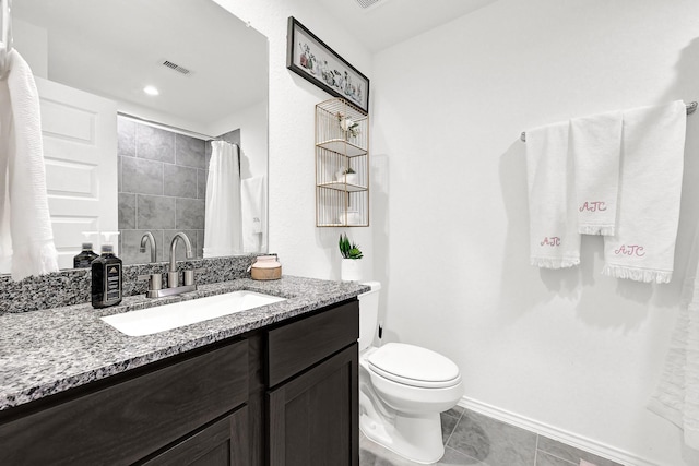 bathroom featuring tile patterned floors, visible vents, toilet, baseboards, and vanity