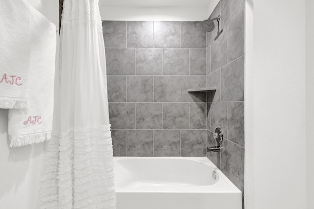 bathroom featuring shower / tub combo with curtain