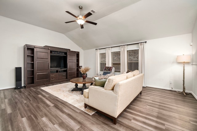 living room featuring dark wood-style floors, baseboards, ceiling fan, and vaulted ceiling