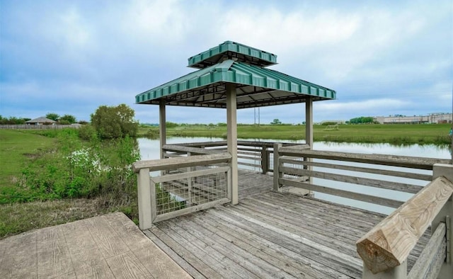 dock area with a gazebo and a deck with water view