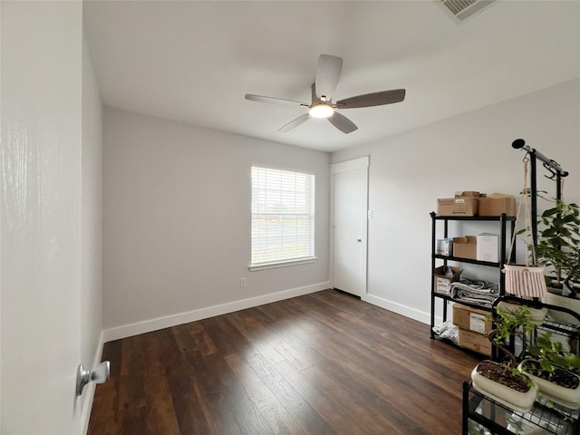 bedroom with dark wood-type flooring, baseboards, visible vents, and ceiling fan