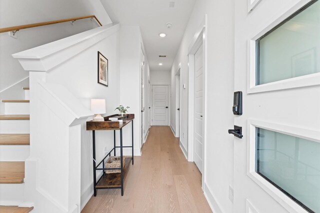 8305 Springwood Creek Ln, Houston, TX 77055 - corridor with light wood-type flooring, recessed lighting, and stairs