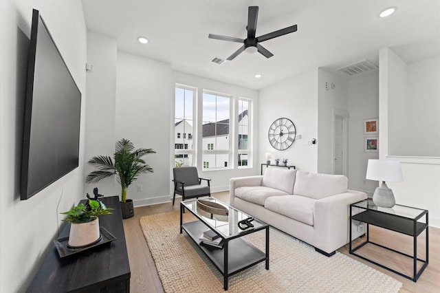 8305 Springwood Creek Ln, Houston, TX 77055 - living area featuring wood finished floors, a ceiling fan, and recessed lighting