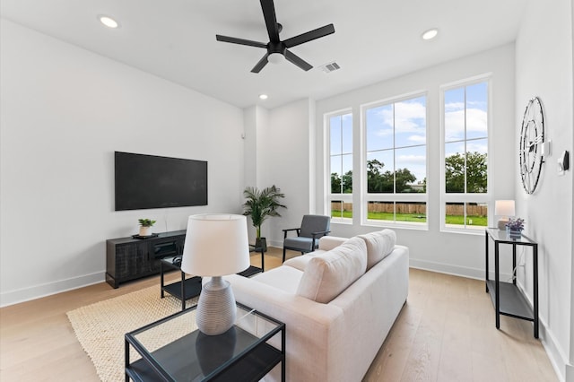 8305 Springwood Creek Ln, Houston, TX 77055 - living area featuring healthy amount of natural light, light wood-style flooring, ceiling fan, and recessed lighting