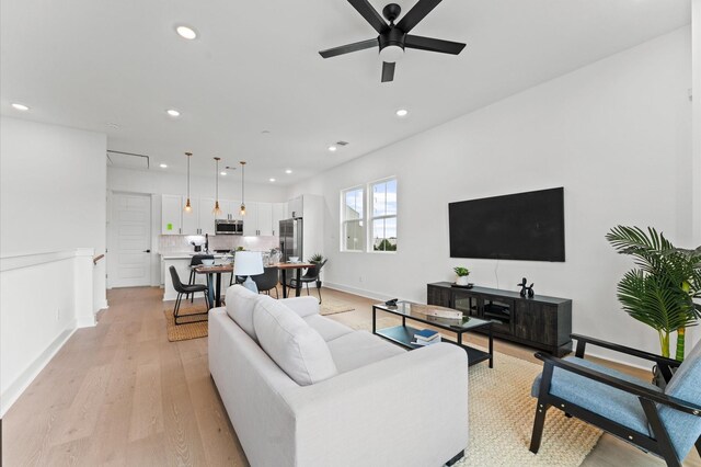 8305 Springwood Creek Ln, Houston, TX 77055 - living area with a ceiling fan, recessed lighting, and light wood-style floors