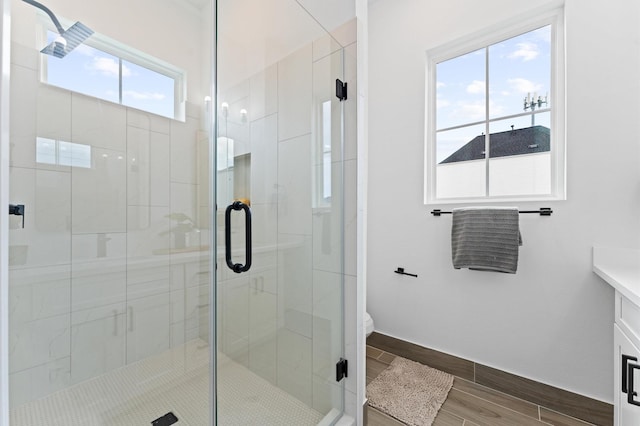 8305 Springwood Creek Ln, Houston, TX 77055 - full bathroom featuring a stall shower, wood tiled floors, and vanity