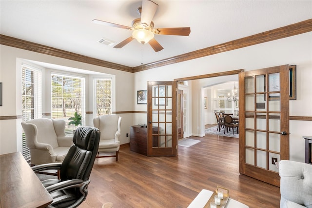 office featuring wood finished floors, visible vents, french doors, and ornamental molding