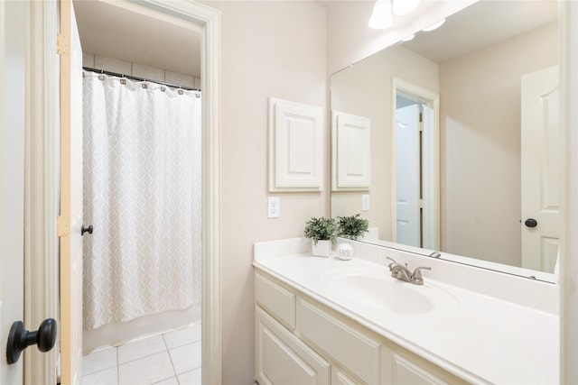 full bath with vanity, tile patterned floors, and shower / bath combo