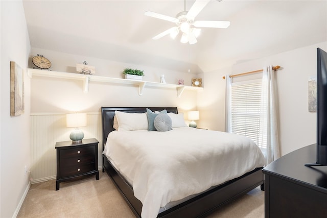 bedroom with light carpet, baseboards, and ceiling fan