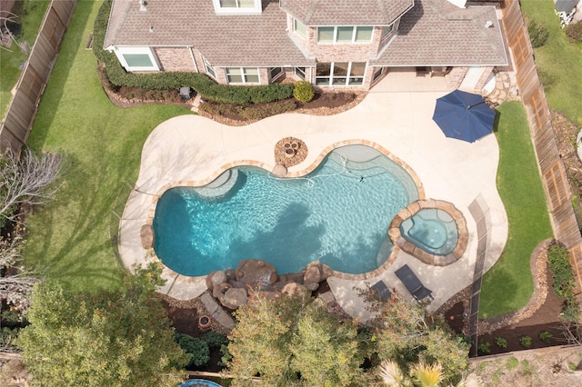 view of swimming pool with a patio, a fenced backyard, and a pool with connected hot tub