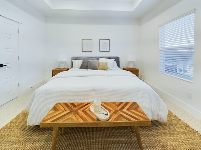 bedroom with carpet and baseboards