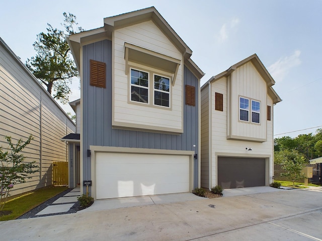 view of front facade with a garage, board and batten siding, and concrete driveway