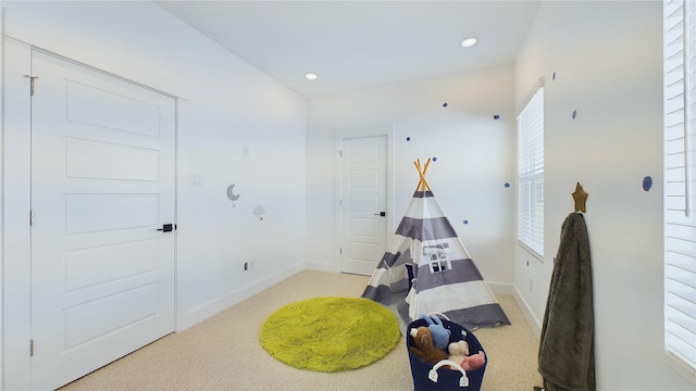 playroom featuring recessed lighting, light colored carpet, and baseboards