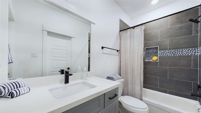 bathroom with vanity, shower / tub combo, and toilet