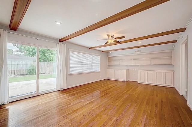 unfurnished living room with light wood-type flooring, built in shelves, beam ceiling, baseboards, and ceiling fan