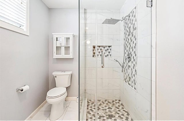 full bathroom with baseboards, toilet, marble finish floor, and a stall shower