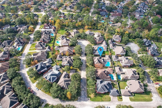 birds eye view of property with a residential view