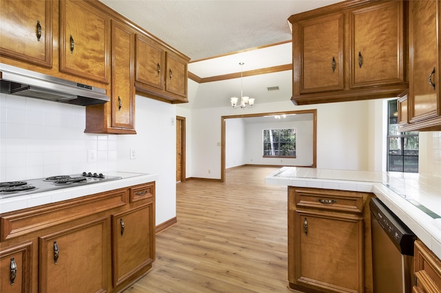 kitchen with under cabinet range hood, light wood-style floors, stainless steel dishwasher, and brown cabinetry