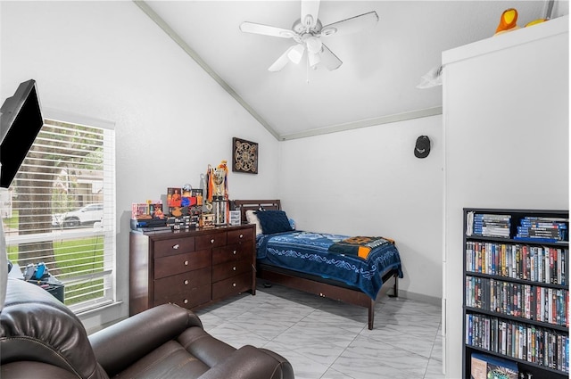 bedroom with marble finish floor, lofted ceiling, and ceiling fan