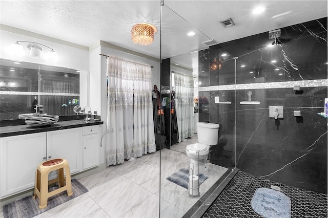 bathroom with visible vents, toilet, marble finish floor, a textured ceiling, and vanity