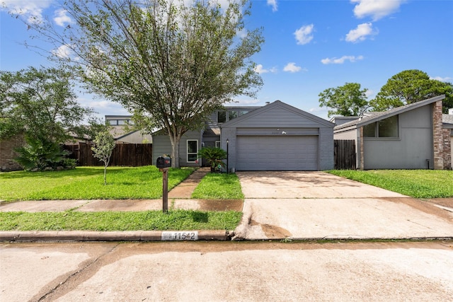 mid-century inspired home with a front yard, concrete driveway, fence, and brick siding