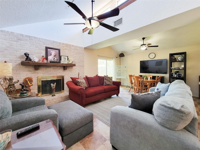 living room featuring visible vents, a brick fireplace, lofted ceiling, a textured ceiling, and a ceiling fan