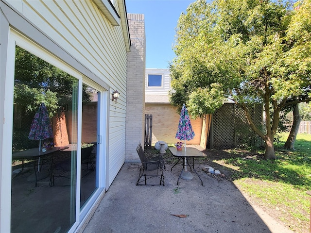 view of patio with fence