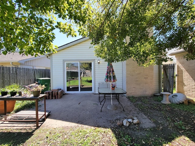 view of patio / terrace featuring fence