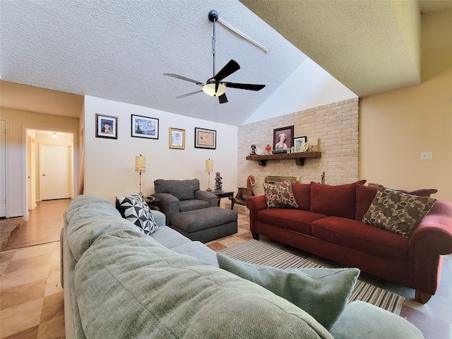 living area featuring a textured ceiling, lofted ceiling, and ceiling fan