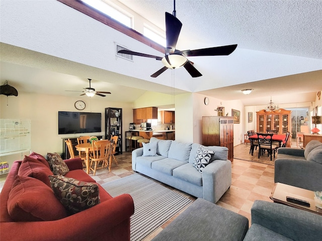 living room with lofted ceiling, light floors, and ceiling fan with notable chandelier