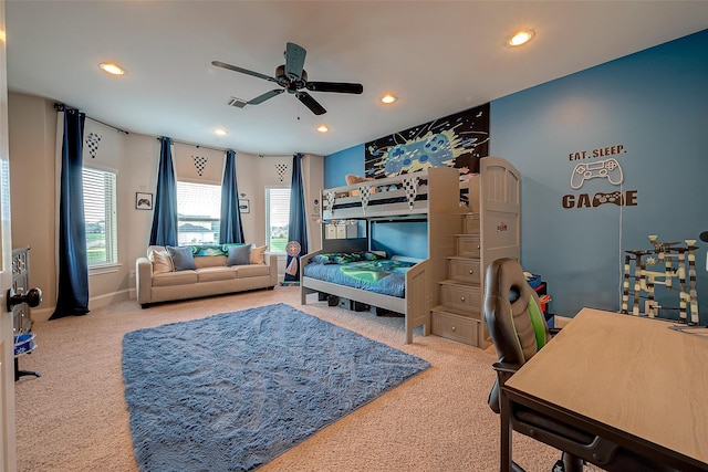 carpeted bedroom featuring recessed lighting, visible vents, multiple windows, and ceiling fan