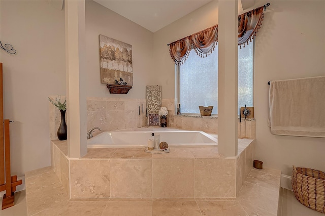 full bathroom featuring tile patterned floors and a garden tub