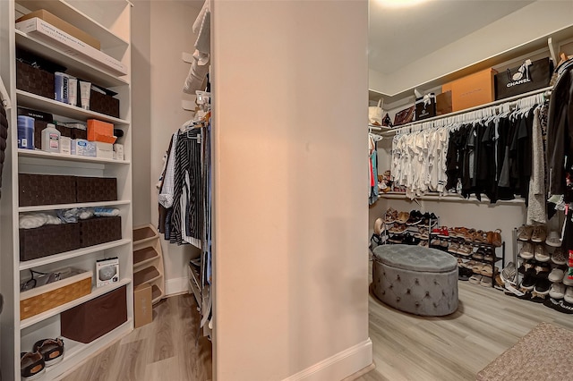 spacious closet with wood finished floors