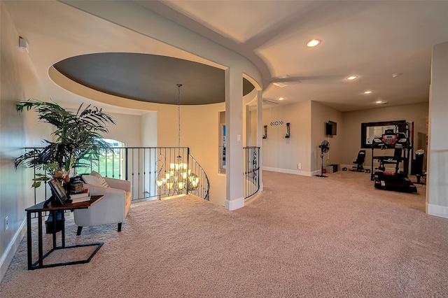 corridor featuring an upstairs landing, a notable chandelier, recessed lighting, carpet flooring, and baseboards