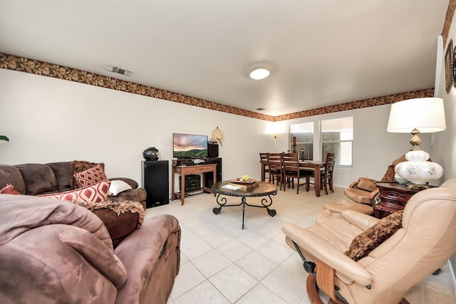 living room with visible vents and light tile patterned flooring