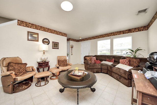 living room with light tile patterned floors and visible vents