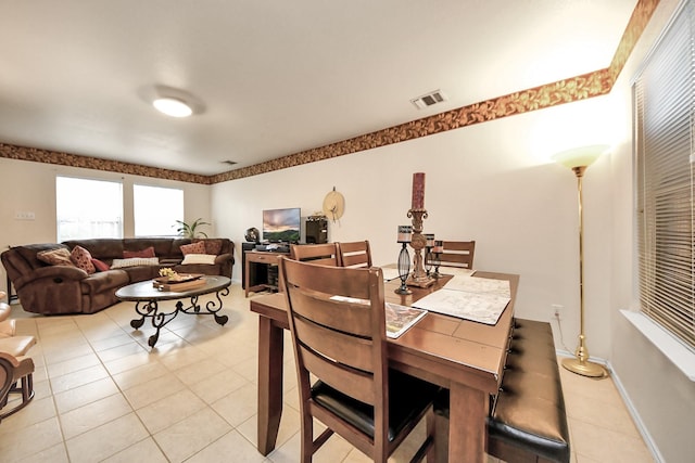 dining space featuring visible vents, baseboards, and light tile patterned flooring