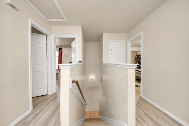 stairs featuring baseboards and wood finished floors