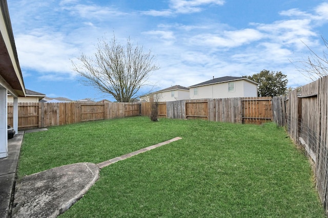 view of yard featuring a fenced backyard