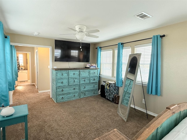 bedroom with visible vents, a ceiling fan, baseboards, and carpet floors