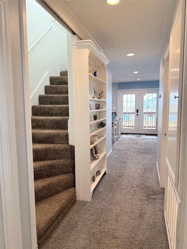 corridor with visible vents, stairs, carpet floors, recessed lighting, and french doors