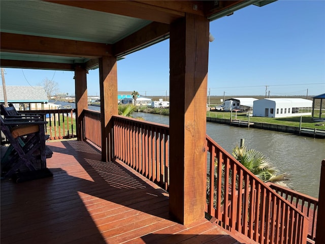 wooden deck featuring a water view