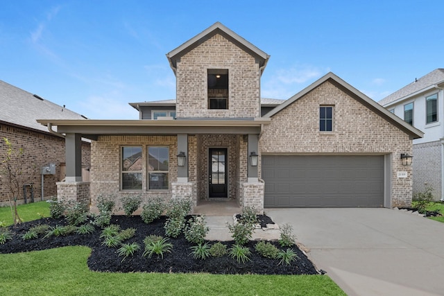 view of front of home with brick siding, a porch, concrete driveway, and an attached garage