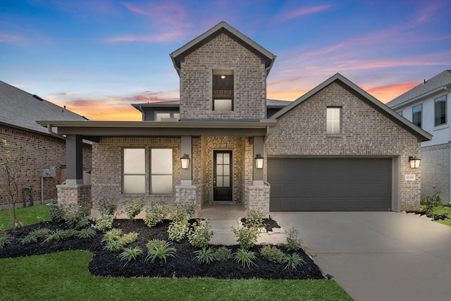 view of front of house featuring brick siding, a porch, concrete driveway, and an attached garage