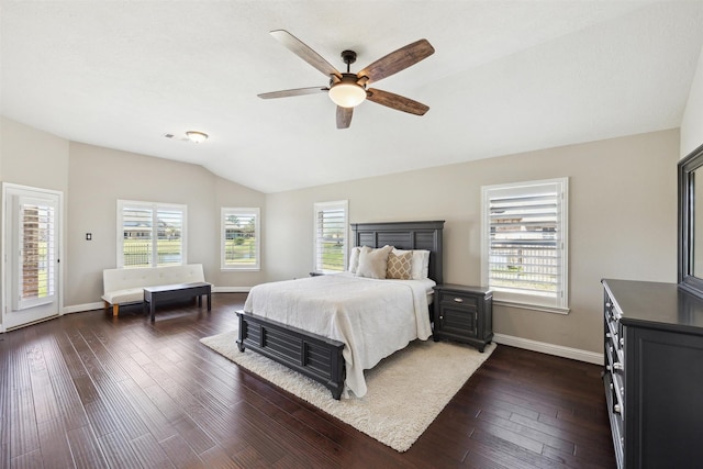 bedroom featuring dark wood-type flooring, baseboards, lofted ceiling, and ceiling fan