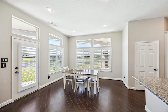 dining area featuring dark wood finished floors, recessed lighting, baseboards, and visible vents