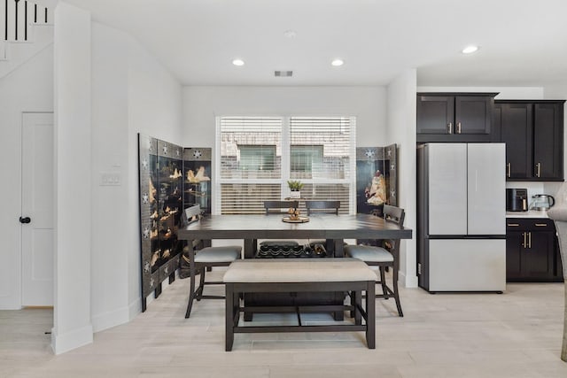 dining area featuring recessed lighting, visible vents, light wood-style flooring, and baseboards