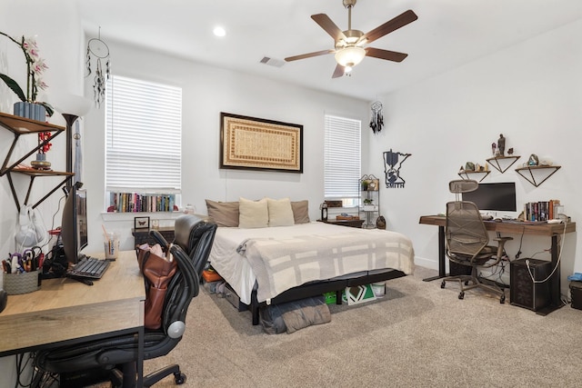 carpeted bedroom with visible vents, recessed lighting, and a ceiling fan