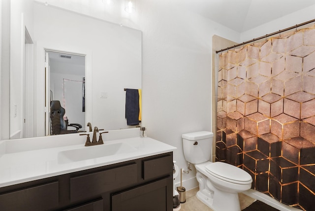 bathroom featuring vanity, a shower with shower curtain, toilet, and visible vents